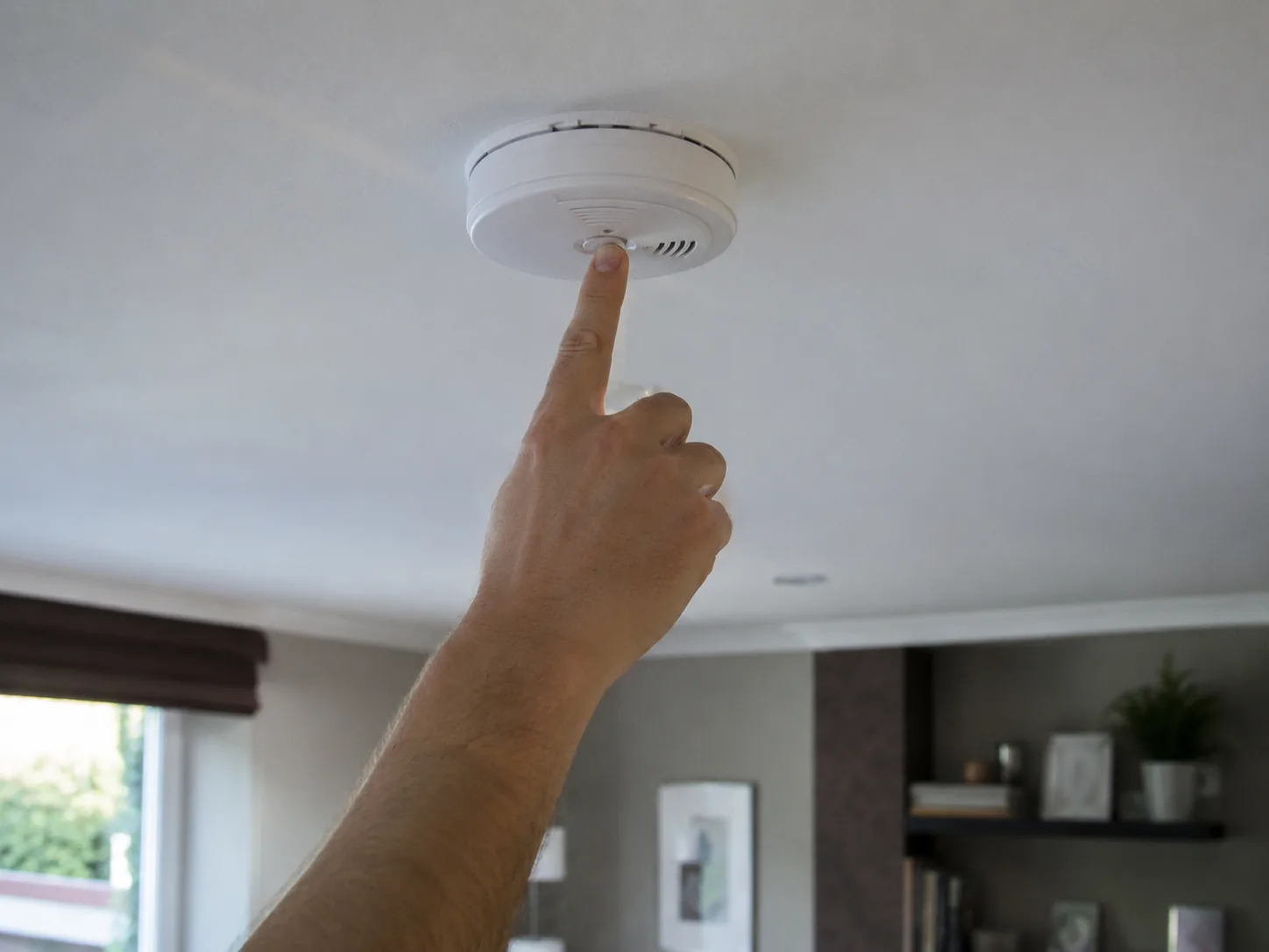 smoke-detectors-03 Smoke Detectors in Farmingdale - NJ being installed on a hallway ceiling during a home safety upgrade